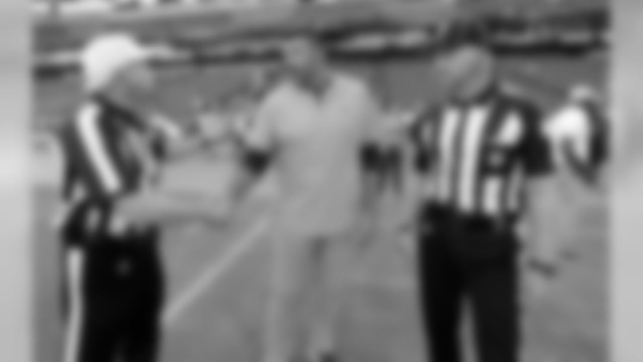 Tennessee Titans head coach Mike Vrabel, center, talks with referee Walt Coleman, left, and line judge Mark Stewart, right, before a preseason NFL football game against the Minnesota Vikings Thursday, Aug. 30, 2018, in Nashville, Tenn. (AP Photo/Mark Zaleski)