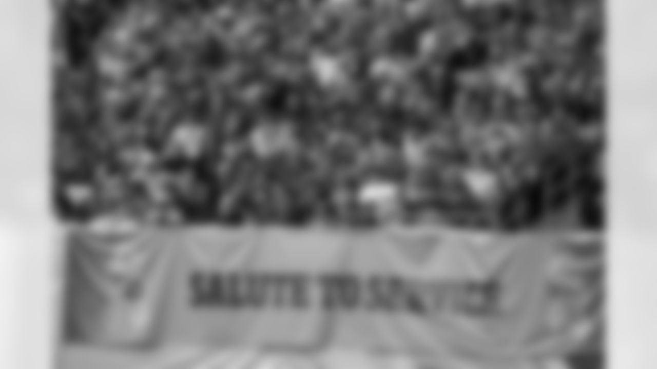 A Salute to Service banner hangs in Nissan Stadium in the first half of an NFL football game between the Tennessee Titans and the New England Patriots Sunday, Nov. 11, 2018, in Nashville, Tenn. (AP Photo/Mark Zaleski)