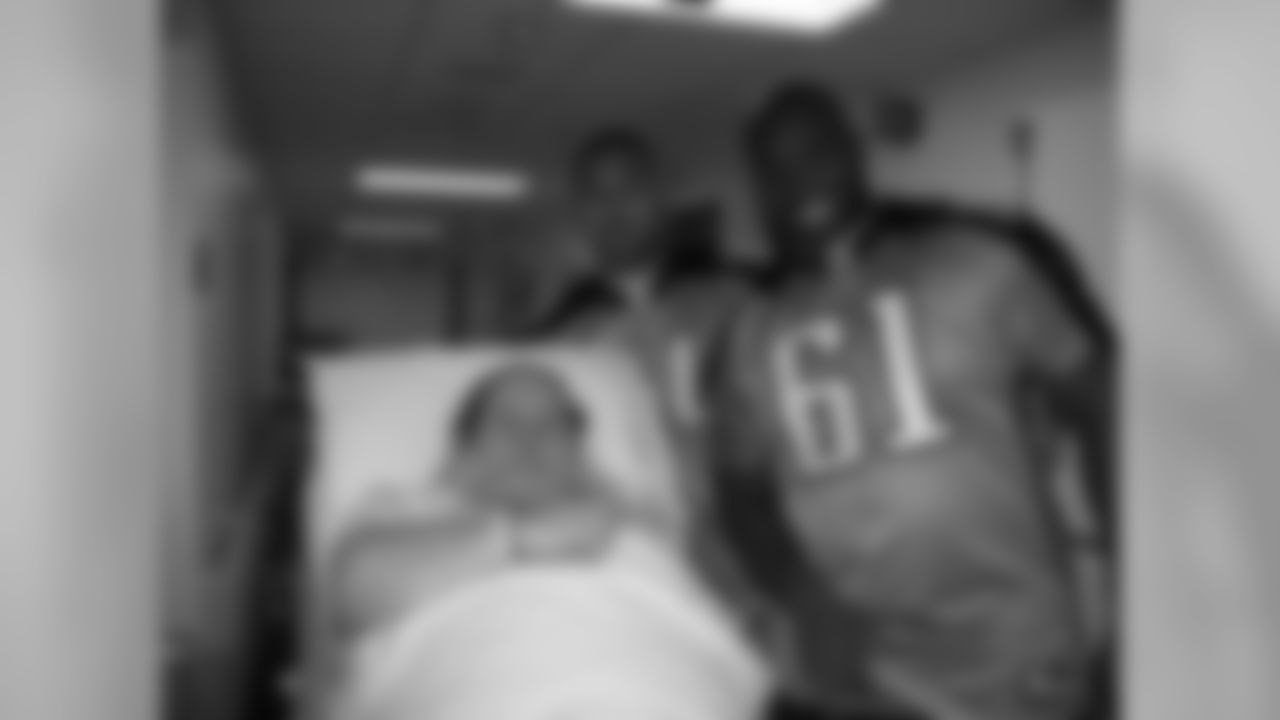 Offensive linemen Troy Kropog (70), Ryand Durand (77), Leroy Harris (64), Eugene Amano (54) and Fernando Velaso (61) visit with patients at Baptist Hospital during their day off from football on Tuesday, Oct. 10, 2009 in Nashville, Tenn.