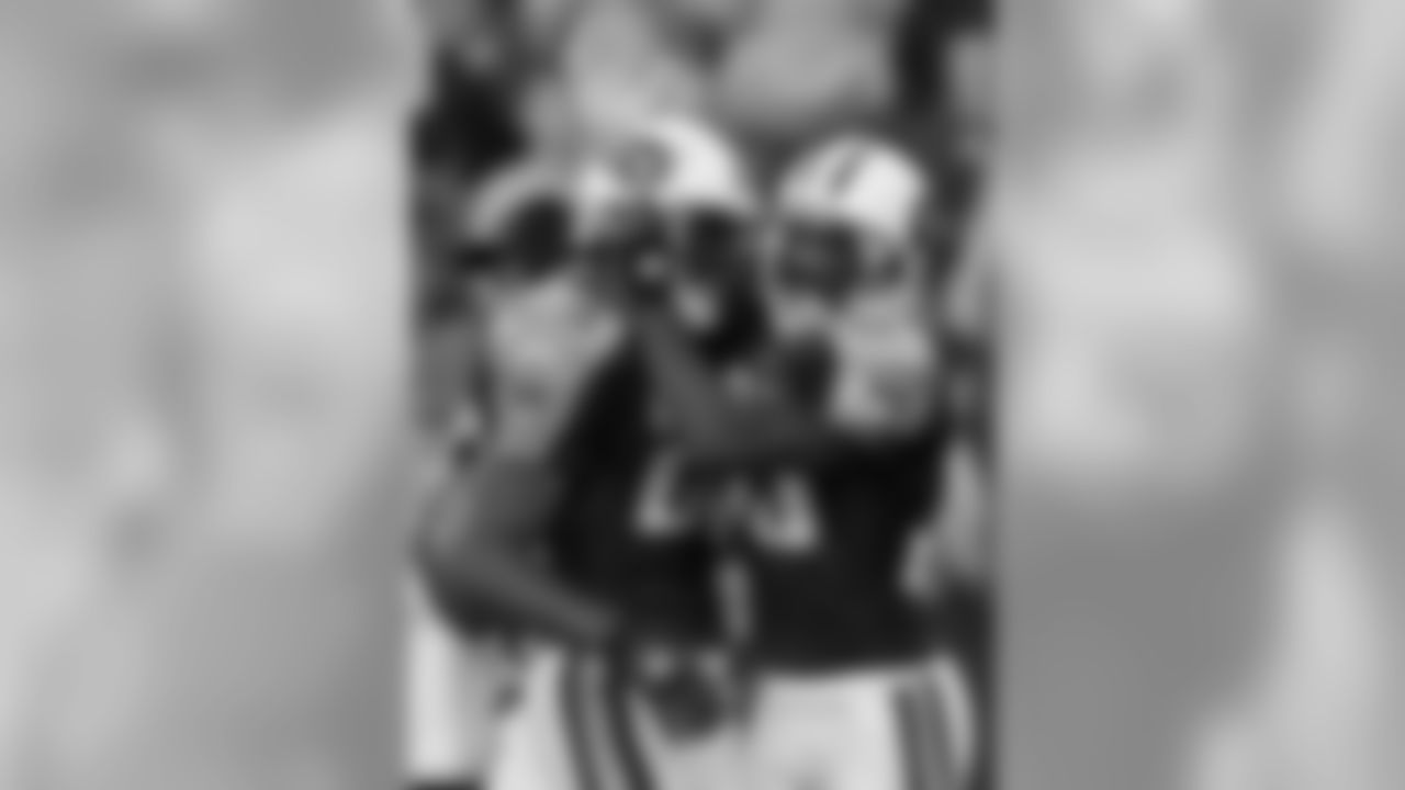 Tennessee Titans Derrick Mason, right, celebrates his touchdown catch with Chris Brown, left, during the first quarter in Nashville, Tenn., Saturday, Aug. 14, 2004.(AP Photo/Wade Payne)