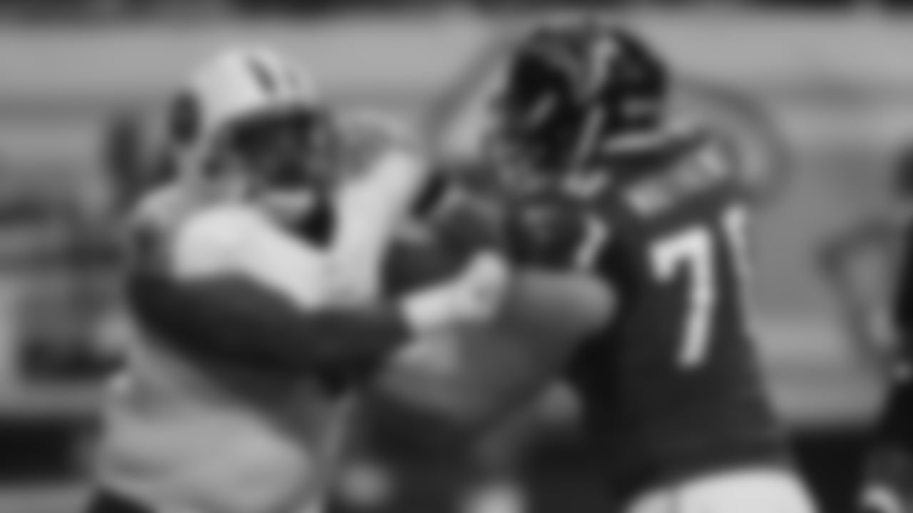 Atlanta Falcons offensive tackle Jake Matthews (70) blocks Tennessee Titans defensive tackle Jurrell Casey (99) during the second half of an NFL preseason football game, Saturday, Aug. 23, 2014, in Atlanta. (AP Photo/John Bazemore)