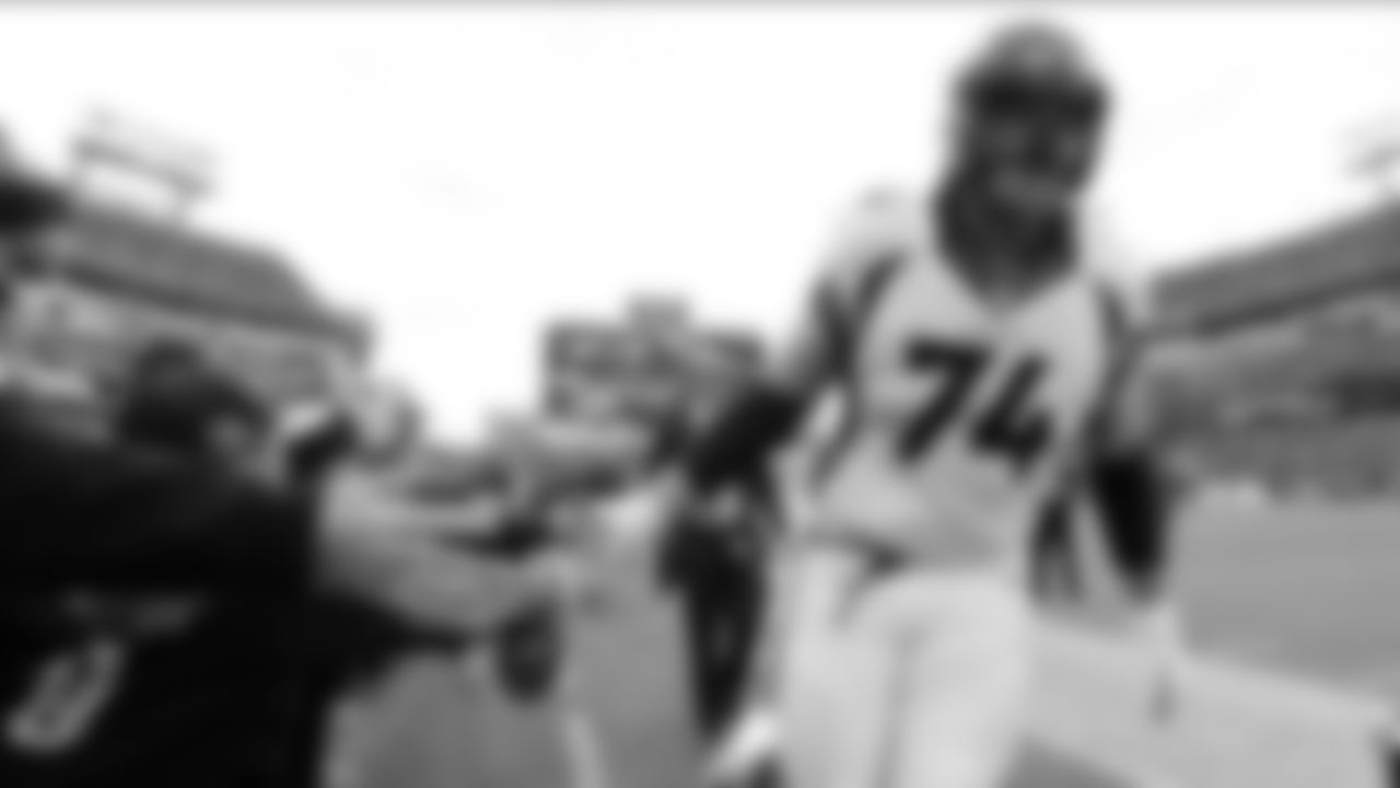 Denver Broncos offensive tackle Ty Sambrailo (74) slaps hands with fans before an NFL football game against the Tennessee Titans Sunday, Dec. 11, 2016, in Nashville, Tenn. (AP Photo/Mark Zaleski)