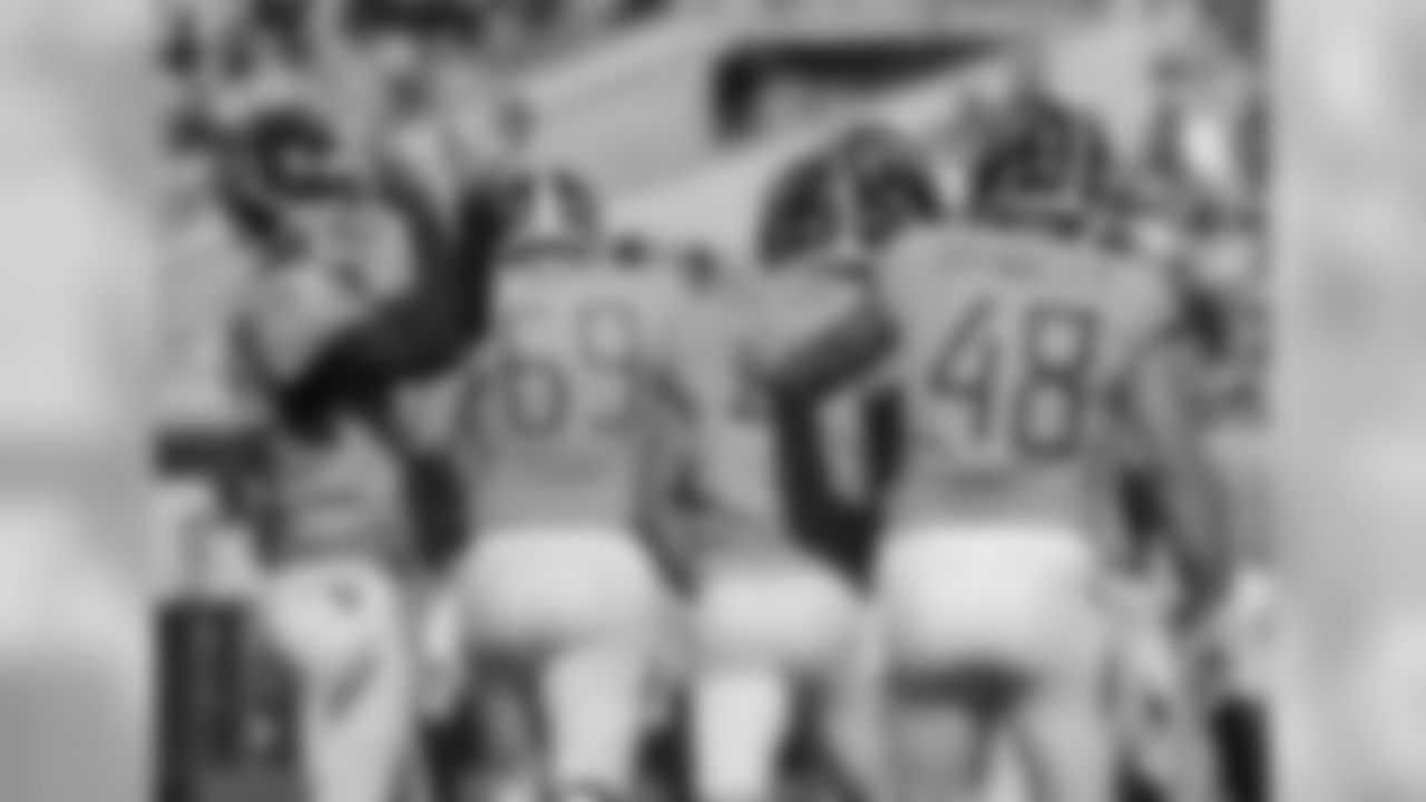 Tennessee Titans' Brett Kern, left, applauds teammate kicker Ryan Succop, center, after Succop made a go-ahead field goal against the Jacksonville Jaguars during the second half of an NFL football game, Sunday, Sept. 23, 2018, in Jacksonville, Fla. (AP Photo/Stephen B. Morton)