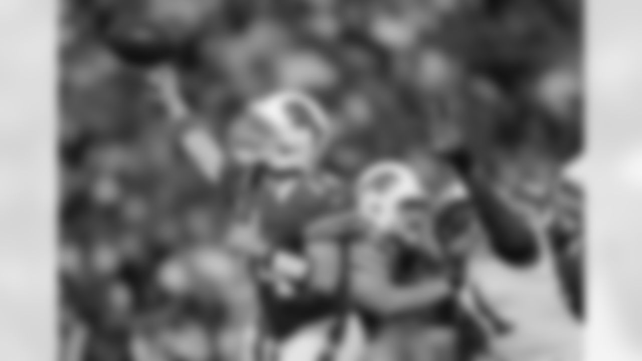 Buffalo Bills quarterback Ryan Fitzpatrick (14) throws under pressure from the Tennessee Titans during the first half of an NFL football game in Orchard Park, N.Y., Sunday, Oct. 21, 2012. (AP Photo/Gary Wiepert)