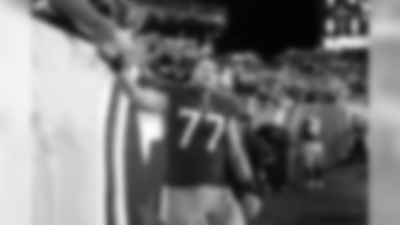 Tennessee Titans offensive tackle Taylor Lewan (77) shakes hands with fans as he leaves the field after an NFL football game against the Indianapolis Colts Sunday, Dec. 30, 2018, in Nashville, Tenn. The Colts won 33-17.(AP Photo/James Kenney)