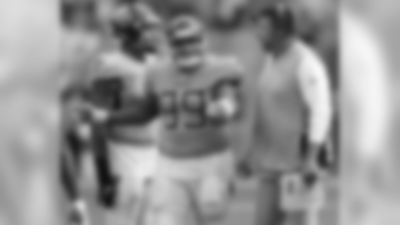 Tennessee Titans head coach Mike Vrabel talks to defensive tackle Jurrell Casey (99), following a scuffle on the field, during the second half of an NFL football game against the Miami Dolphins, Sunday, Sept. 9, 2018, in Miami Gardens, Fla. (AP Photo/Brynn Anderson)