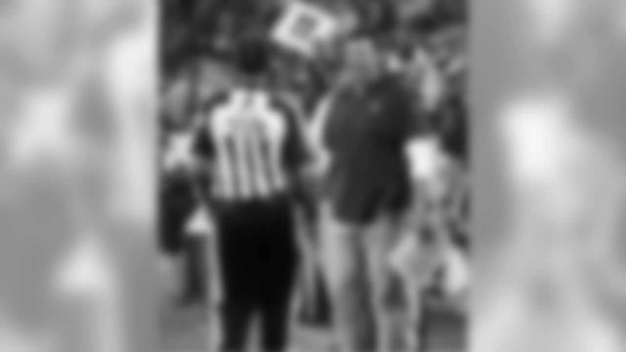 Tennessee Titans head coach Mike Vrabel talks with field judge Dave Meslow (118)in the first half of a preseason NFL football game Sunday, Aug. 19, 2018, in Nashville, Tenn. (AP Photo/James Kenney)