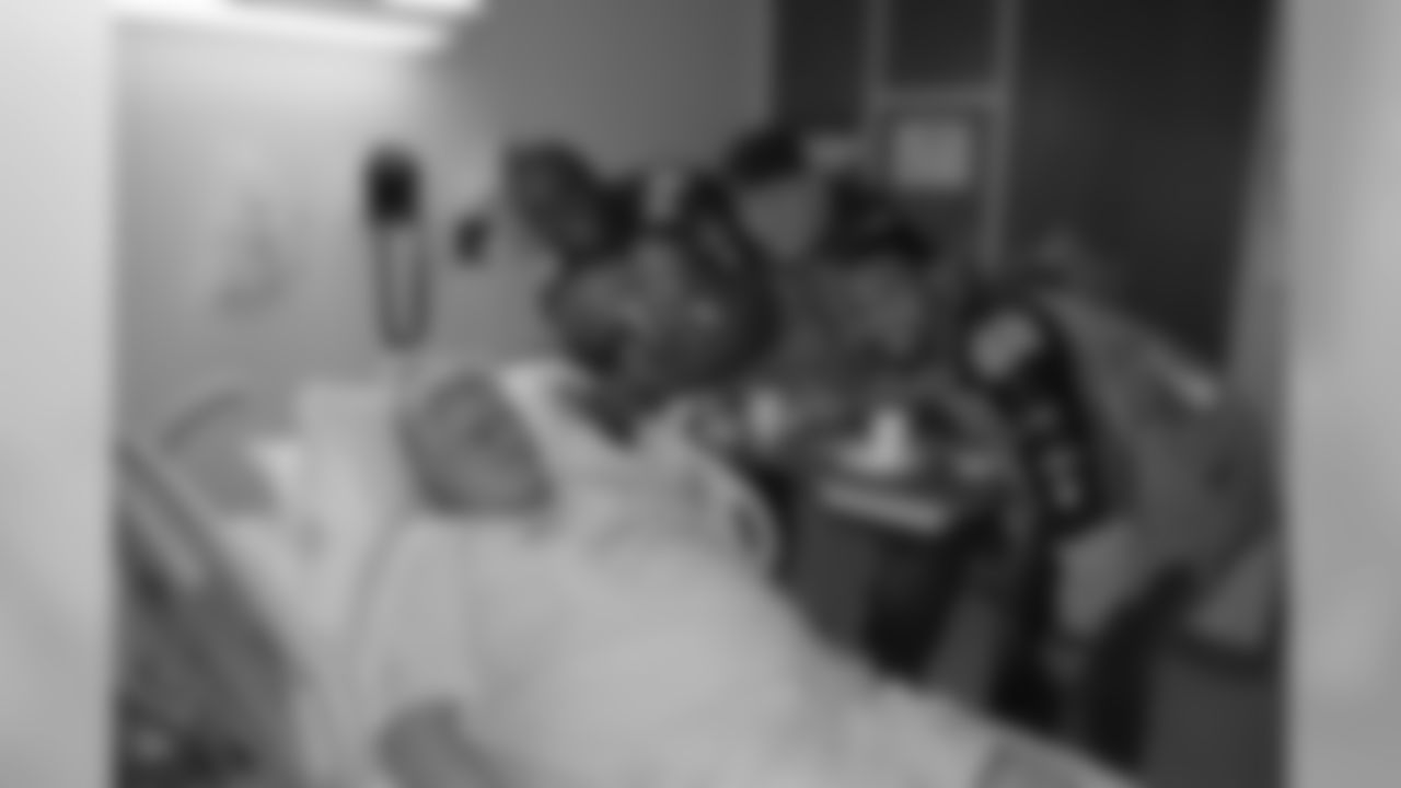 Titans players Jovan Haye (75), Kevin Vickerson (96), Sen'Derrick Marks (94), Mitch King (62) and Ryan Mouton (29) visit patients at Saint Thomas Hospital on Tuesday, Dec. 8, 2009 in Nashville, Tenn.