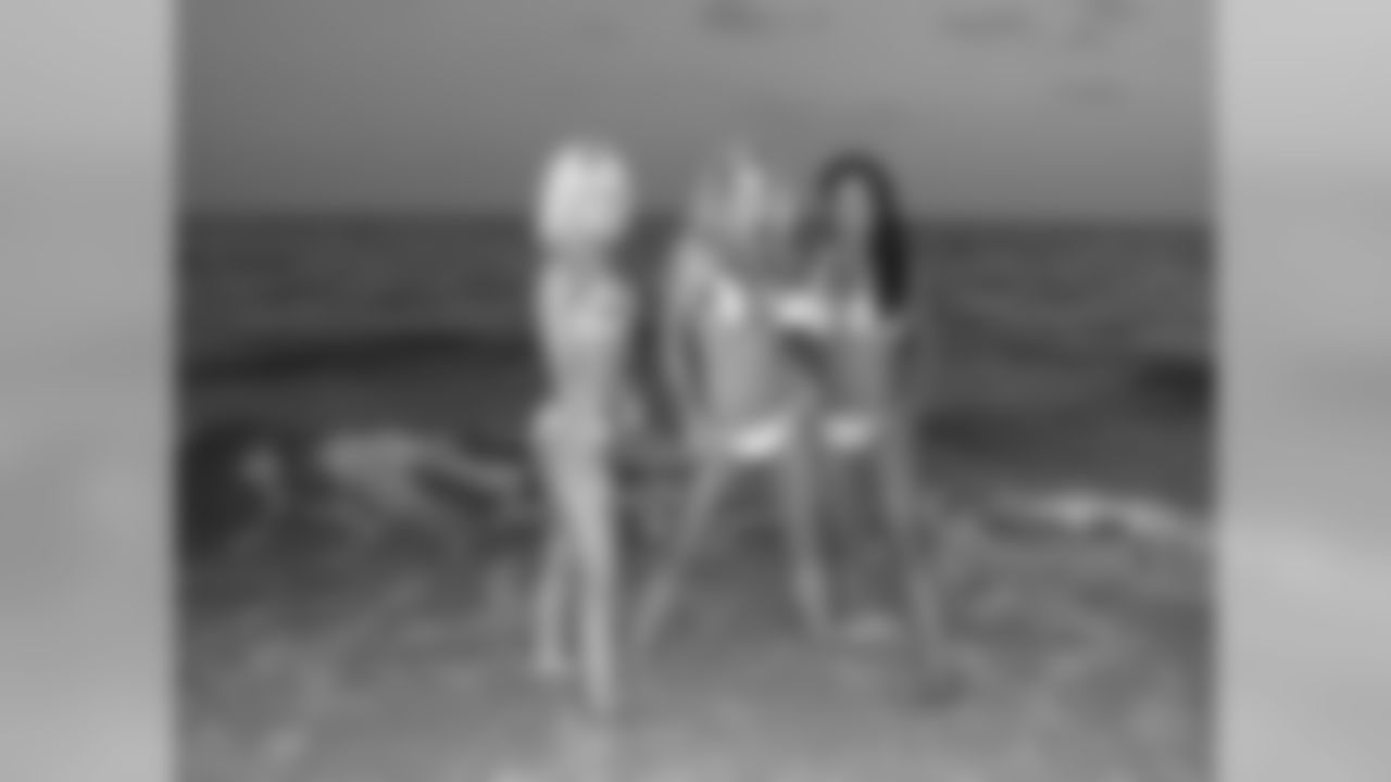 Tennessee Titans cheerleaders take part in a sunset photo shoot Tuesday afternoon at the Sandestin Golf and Beach Resort.