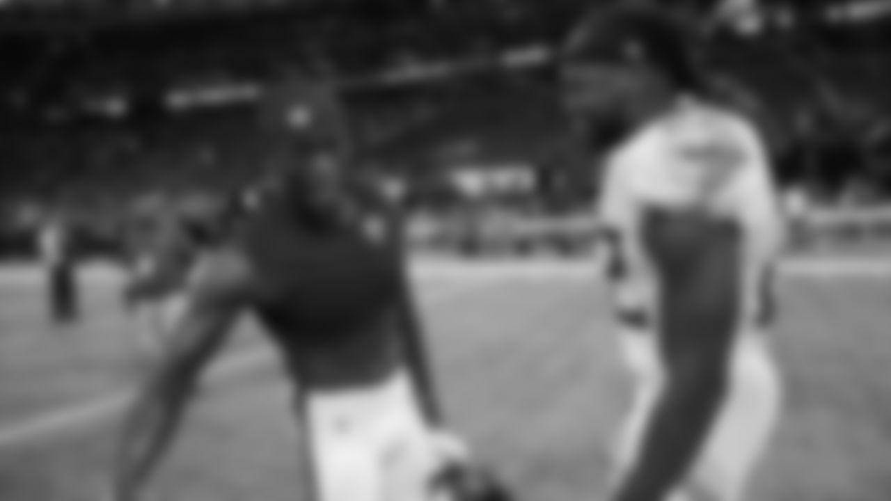 Former Alabama football players Atlanta Falcons wide receiver Julio Jones, left, and Tennessee Titans running back Derrick Henry speak after an NFL football game, Sunday, Sept. 29, 2019, in Atlanta. The Tennessee Titans won 24-10. (AP Photo/John Bazemore)