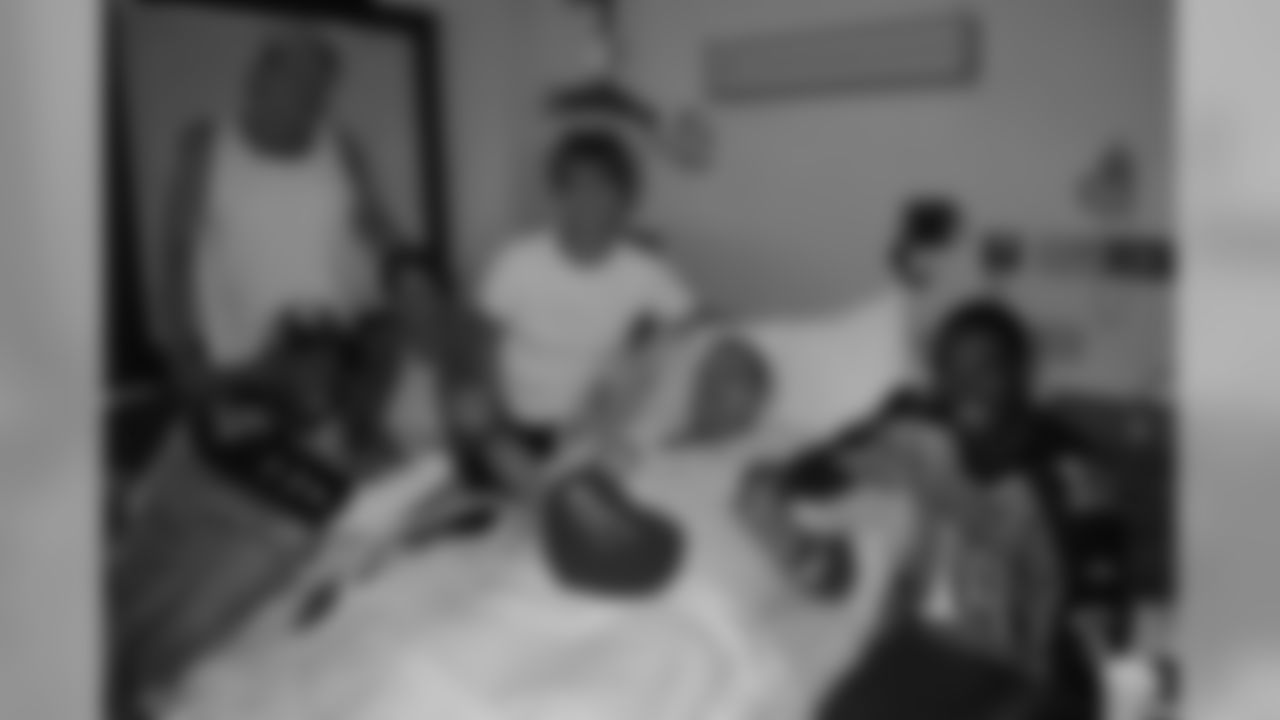 Titans wide receivers Justin Gage (12), Nate Washington (85), Kenny Britt (18) and Phillip Morris (16) visit with patients at Saint Thomas Hospital in Nashville Tenn. during their day off from football on Tuesday, Sept. 29, 2009.