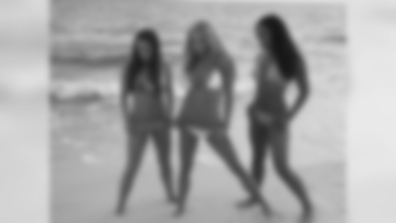 Tennessee Titans cheerleaders take part in a sunset photo shoot Tuesday afternoon at the Sandestin Golf and Beach Resort.