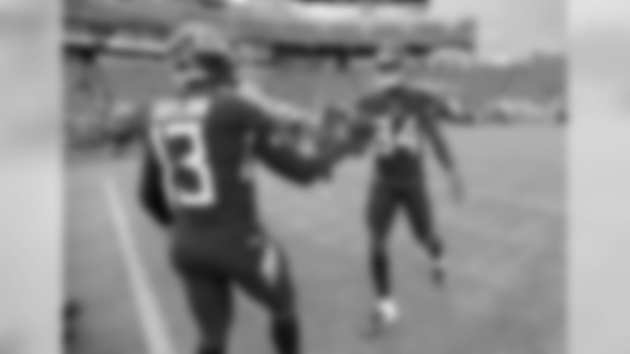 Tennessee Titans wide receiver Taywan Taylor (13) shakes hands with wide receiver Corey Davis (84) before a preseason NFL football game against the Minnesota Vikings Thursday, Aug. 30, 2018, in Nashville, Tenn. (AP Photo/Mark Zaleski)