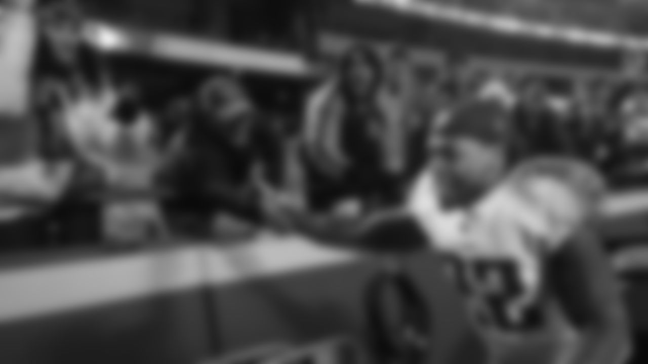 Tennessee Titans running back Derrick Henry (22) visits with fans after beating the Kansas City Chiefs in an NFL wild-card playoff game in Kansas City, Mo., Saturday, Jan. 6, 2018. (AP Photo/Reed Hoffmann)