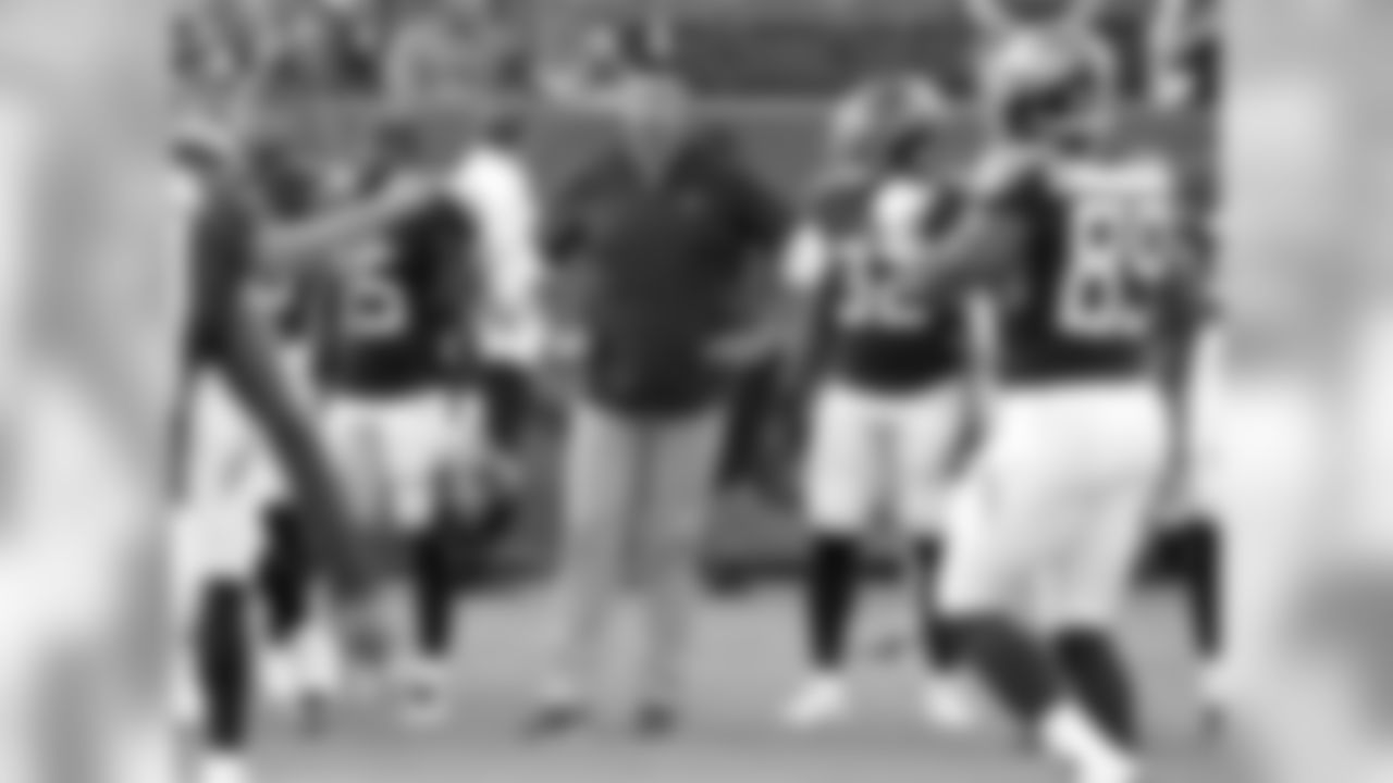 Tennessee Titans head coach Mike Vrabel, center, watches as players warm up before a preseason NFL football game between the Titans and the Tampa Bay Buccaneers Saturday, Aug. 18, 2018, in Nashville, Tenn. (AP Photo/Mark Zaleski))