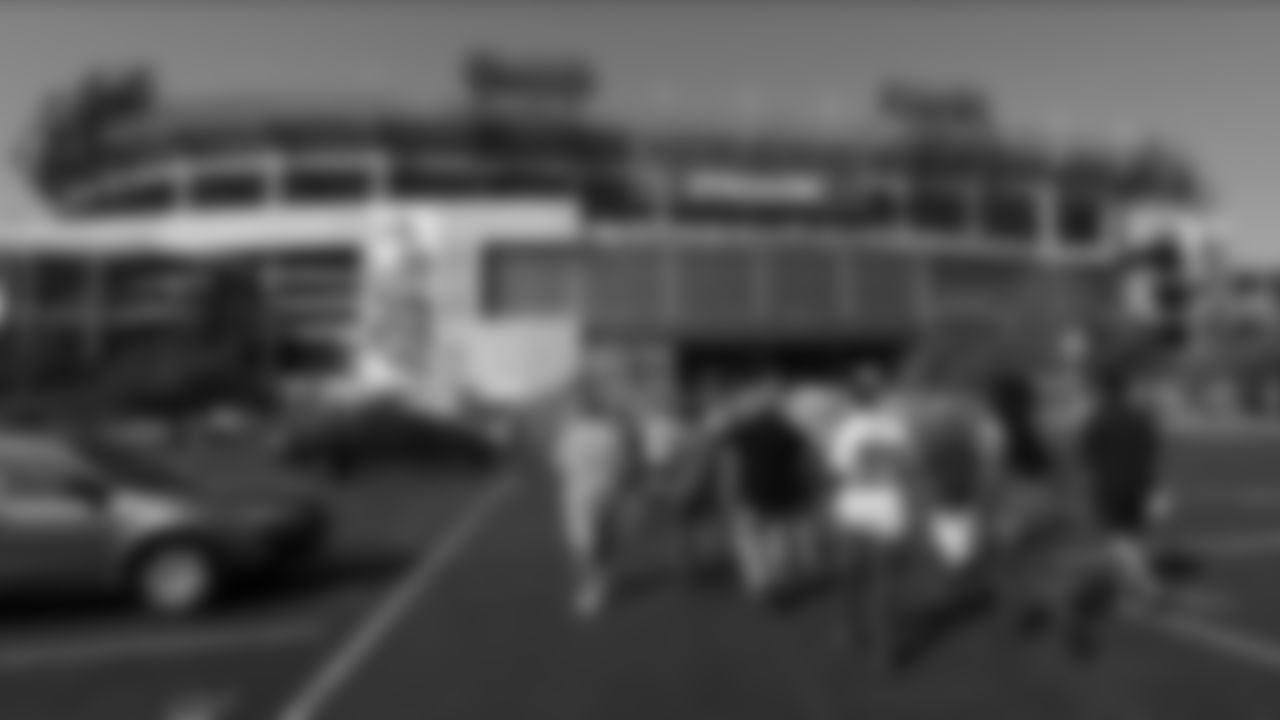 Fans arrive at Nissan Stadium for an NFL football game between the Tennessee Titans and the Indianapolis Colts Sunday, Sept. 15, 2019, in Nashville, Tenn. (AP Photo/Wade Payne)