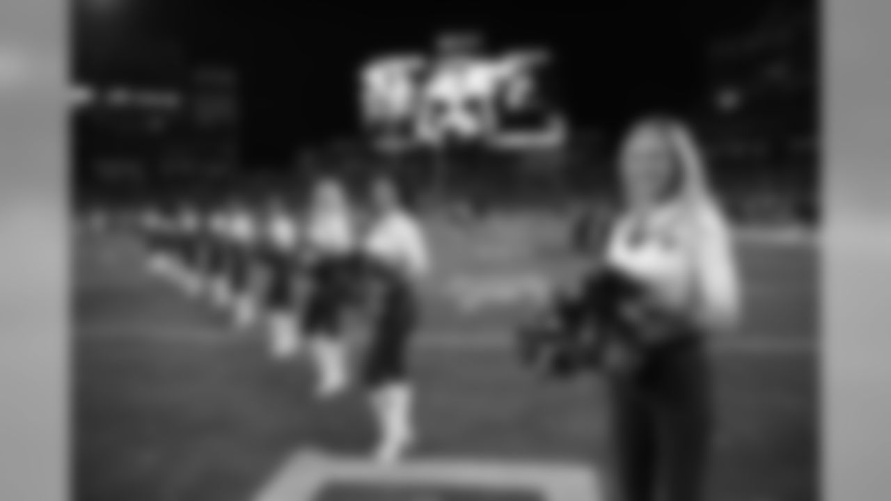 Tennessee Titans cheerleaders walks the turf the first half of an NFL football game between the Tennessee Titans and the Jacksonville Jaguars, Thursday, Dec. 6, 2018, in Nashville, Tenn. (AP Photo/James Kenney)