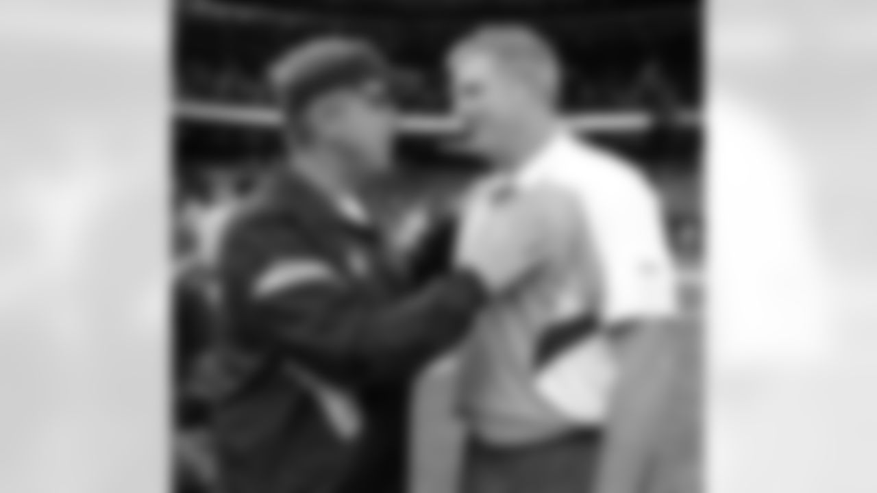 New Orleans Saints head coach Sean Payton , left, talks with Tennessee Titans head coach Mike Munchak at an NFL preseason football game at the Louisiana Superdome in New Orleans, Thursday, Sept. 1, 2011. The Titans won 32-9. (AP Photo/Bill Haber)