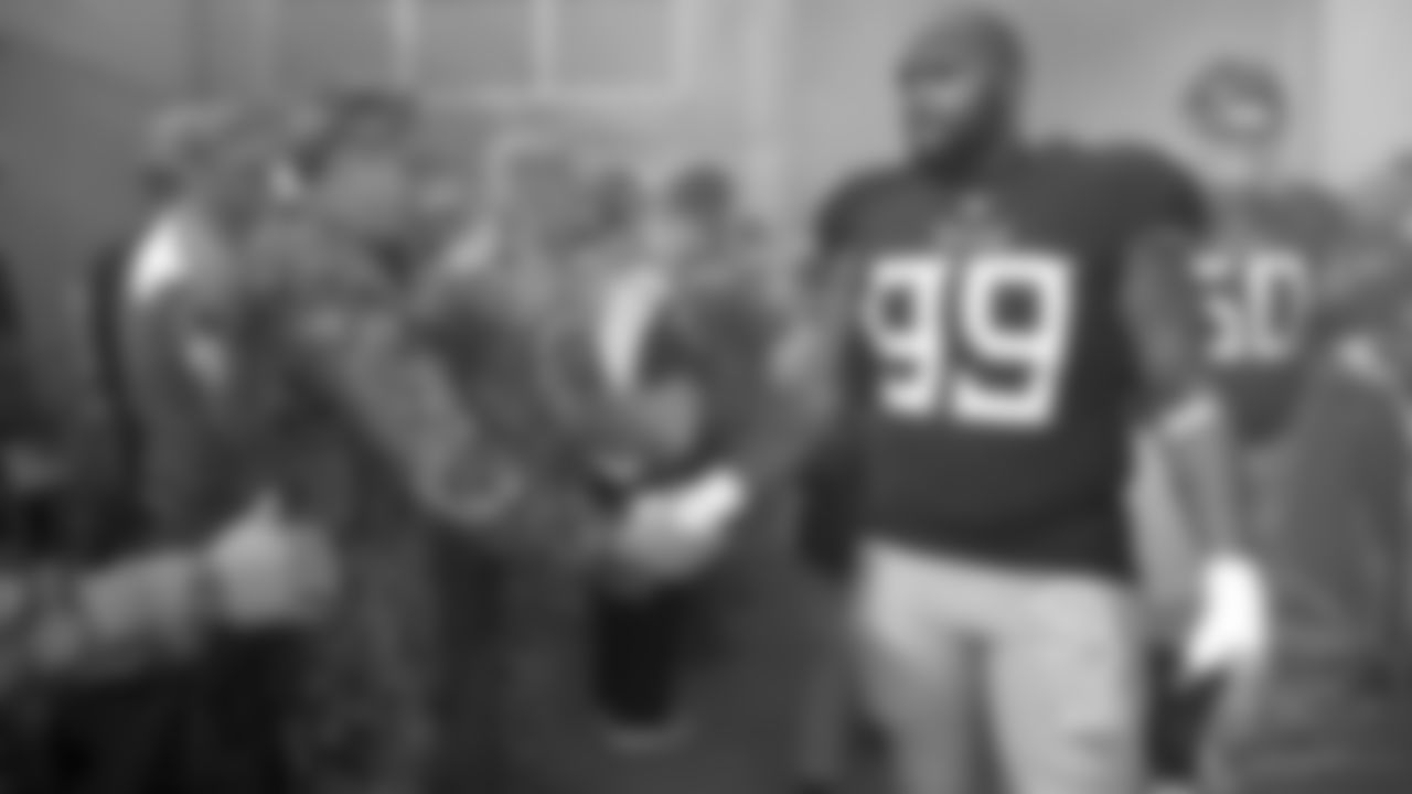 Tennessee Titans defensive end Jurrell Casey (99) shakes hands with a soldier before an NFL football game between the Titans and the New England Patriots Sunday, Nov. 11, 2018, in Nashville, Tenn. (AP Photo/James Kenney)