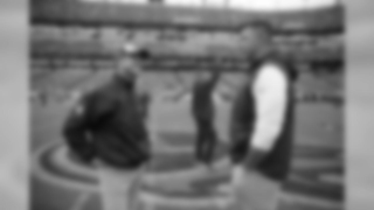 Baltimore Ravens head coach John Harbaugh, left, and Tennessee Titans head coach Mike Vrabel talk before an NFL football game Sunday, Oct. 14, 2018, in Nashville, Tenn. (AP Photo/James Kenney)