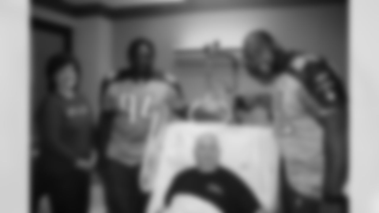 Titans players Jovan Haye (75), Kevin Vickerson (96), Sen'Derrick Marks (94), Mitch King (62) and Ryan Mouton (29) visit patients at Saint Thomas Hospital on Tuesday, Dec. 8, 2009 in Nashville, Tenn.