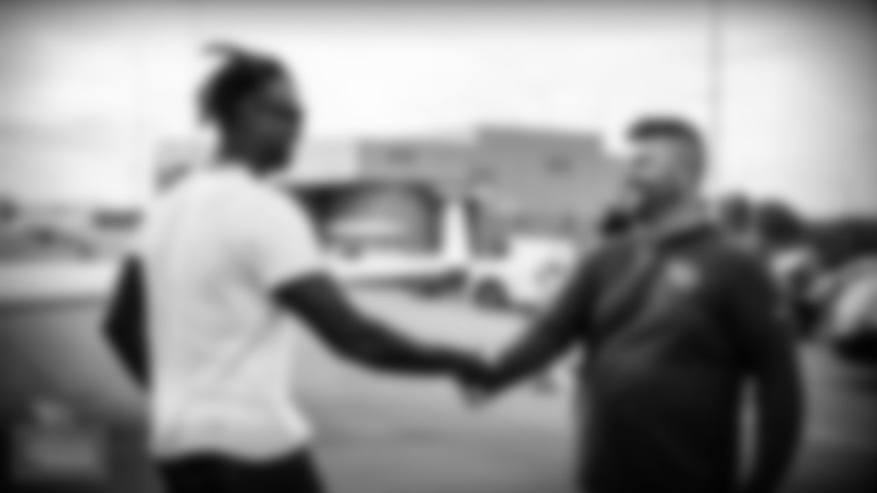 NASHVILLE, TN - JUNE 07, 2021 - Julio Jones greets General Manager of the Tennessee Titans Jon Robinson in Nashville, TN. Photo By Donald Page/Tennessee Titans