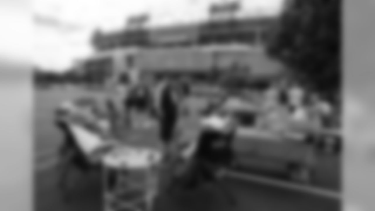 Fans tailgate outside Nissan Stadium before an NFL football game between the Tennessee Titans and the Houston Texans Sunday, Sept. 16, 2018, in Nashville, Tenn. (AP Photo/James Kenney)