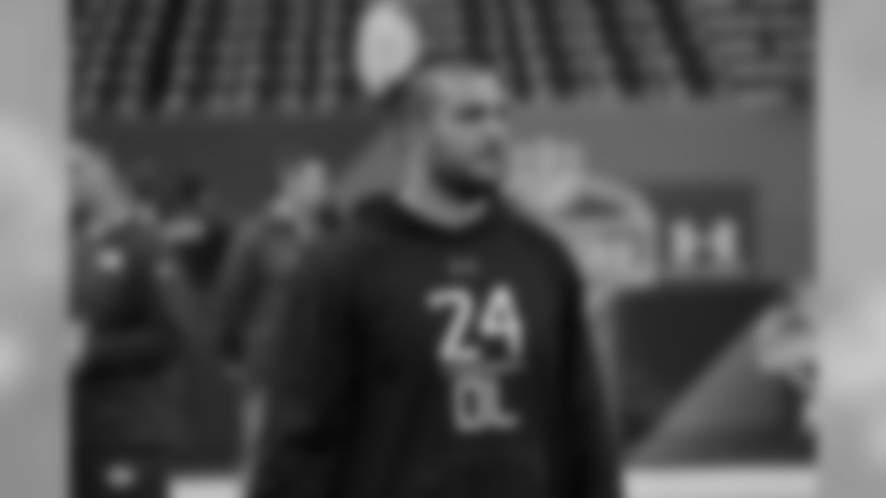 Oregon offensive lineman Hroniss Grasu watches players warm up at the NFL football scouting combine in Indianapolis, Friday, Feb. 20, 2015. (AP Photo/David J. Phillip)