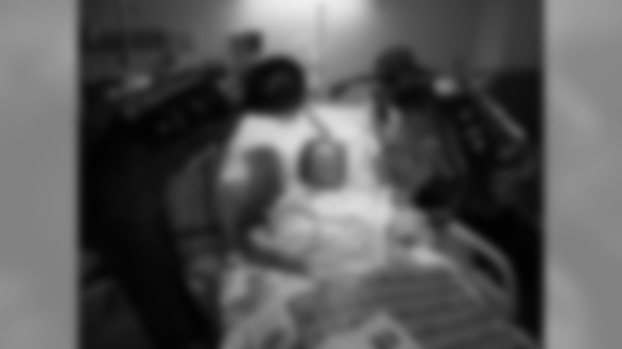 Titans wide receivers Justin Gage (12), Nate Washington (85), Kenny Britt (18) and Phillip Morris (16) visit with patients at Saint Thomas Hospital in Nashville Tenn. during their day off from football on Tuesday, Sept. 29, 2009.