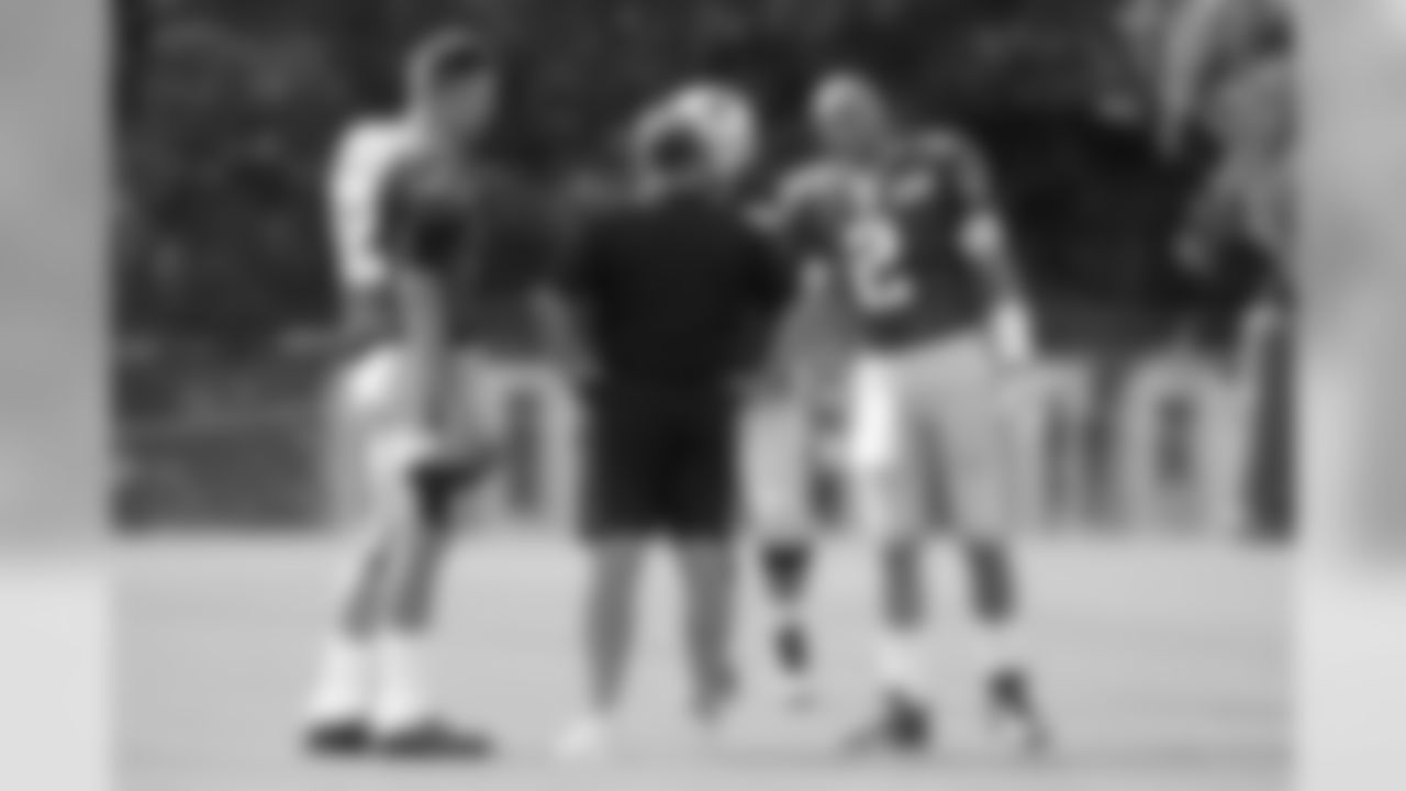 New England Patriots head coach Bill Belichick, center, talks with quarterbacks Tom Brady (12) and Brian Hoyer (2) during a combined NFL football training camp with the Tennessee Titans Wednesday, Aug. 14, 2019, in Nashville, Tenn. (AP Photo/Mark Humphrey)