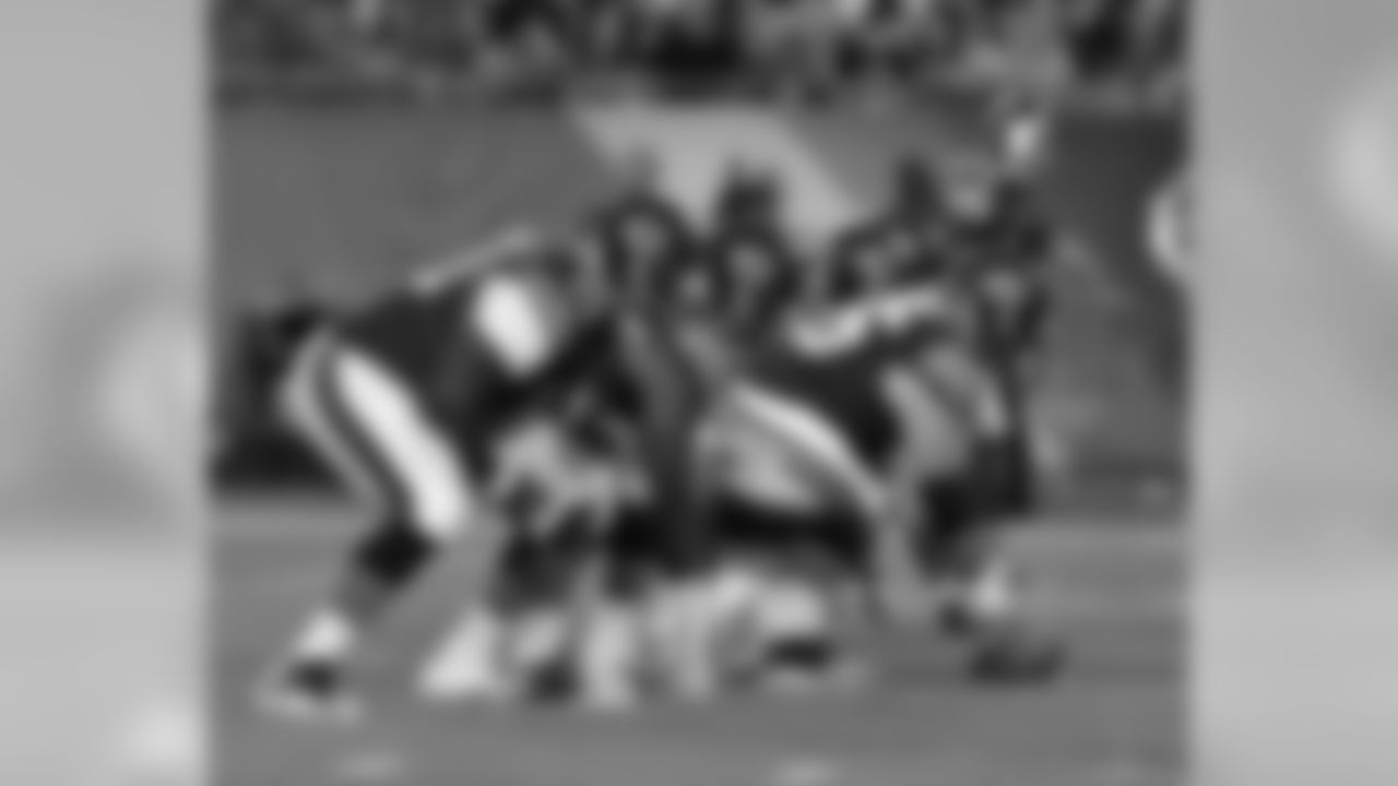 Tackle Michael Ola (70) and center Hroniss Grasu (55) of the Chicago Bears set for play against the Miami Dolphins in a pre-season NFL game August 13, 2015 at Soldier Field in Chicago. The Bears won 27 - 10. (AP Photo / Al Messerschmidt)