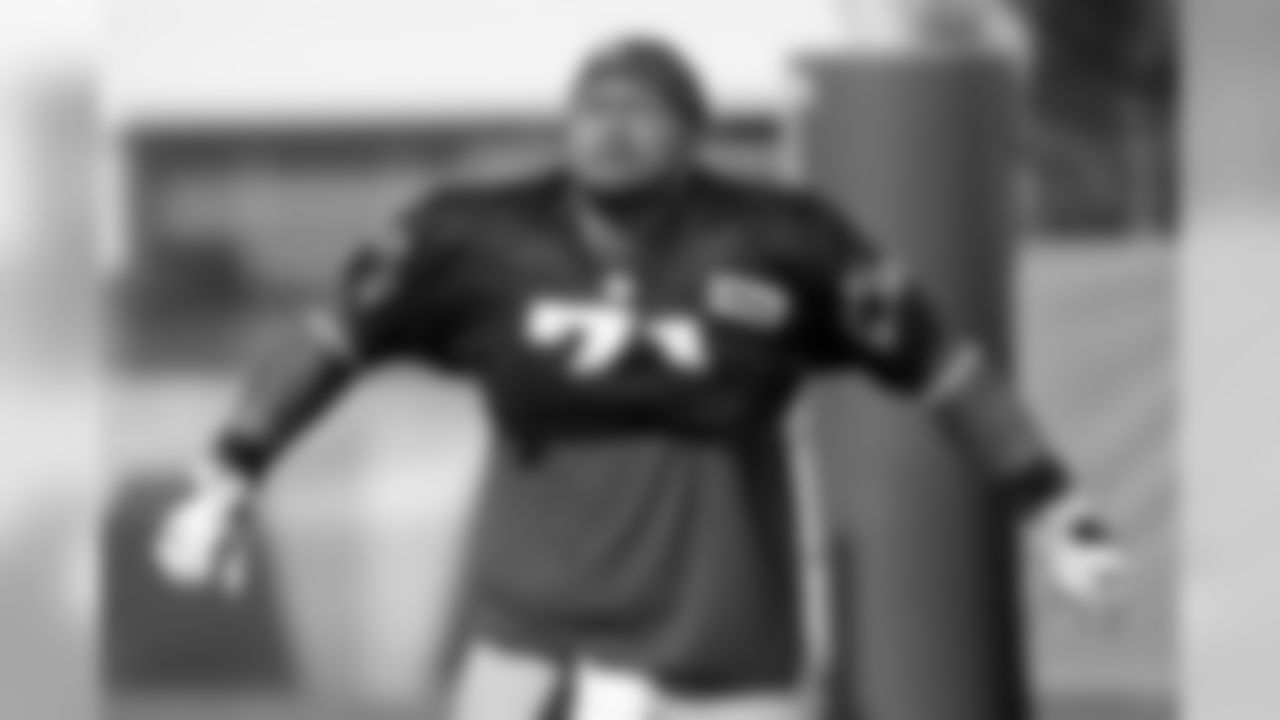 New England Patriots defensive tackle Danny Shelton pulls on his jersey before a combined NFL football training camp with the Tennessee Titans Wednesday, Aug. 14, 2019, in Nashville, Tenn. (AP Photo/Mark Humphrey)