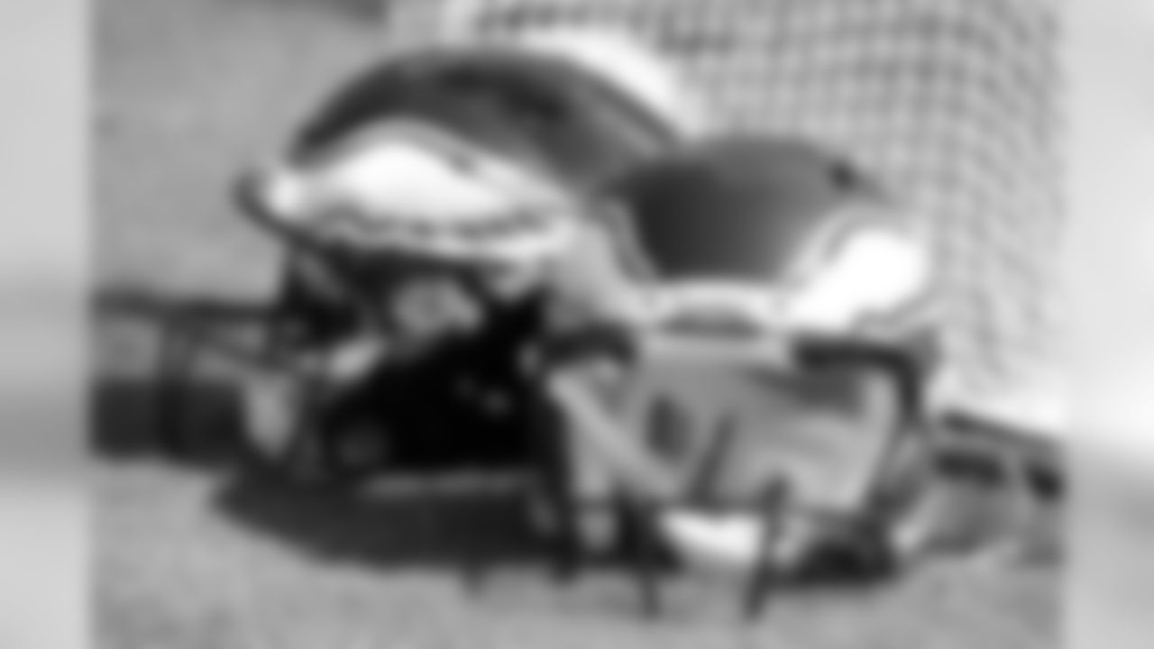 Philadelphia Eagles helmets sit on the field before an NFL football game between the Eagles and the Tennessee Titans Sunday, Sept. 30, 2018, in Nashville, Tenn. (AP Photo/Mark Zaleski)