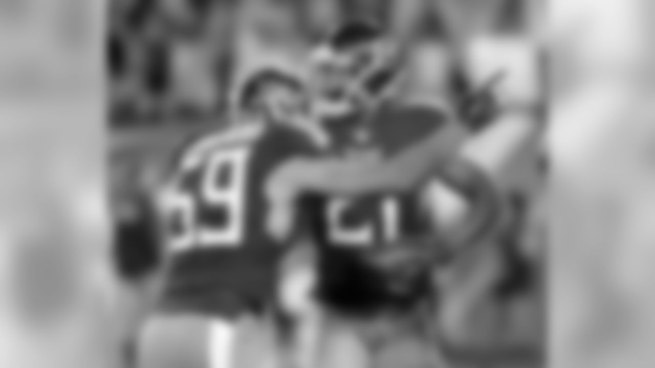 Tennessee Titans cornerback Malcolm Butler (21) celebrates with inside linebacker Wesley Woodyard (59) after Butler intercepted a pass in the final seconds of the fourth quarter to end the New York Jets' final drive in an NFL football game Sunday, Dec. 2, 2018, in Nashville, Tenn. The Titans won 26-22. (AP Photo/Mark Zaleski)