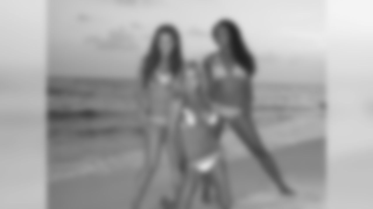 Tennessee Titans cheerleaders take part in a sunset photo shoot Tuesday afternoon at the Sandestin Golf and Beach Resort.