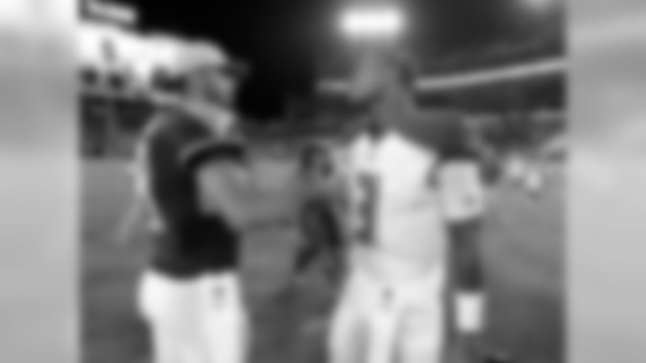 Tennessee Titans quarterback Marcus Mariota, left, meets with Tampa Bay Buccaneers quarterback Jameis Winston after a preseason NFL football game Saturday, Aug. 18, 2018, in Nashville, Tenn. The Buccaneers won 30-14. (AP Photo/Mark Zaleski)
