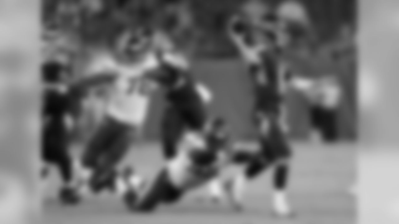 Tennessee Titans quarterback Luke Falk (11) passes as he is pressured by Minnesota Vikings defensive end Ifeadi Odenigbo (95) in the second half of a preseason NFL football game Thursday, Aug. 30, 2018, in Nashville, Tenn. (AP Photo/James Kenney)