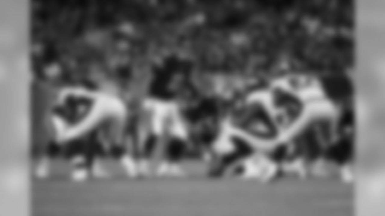 Chicago Bears quarterback Mitchell Trubisky (10) and Chicago Bears center Hroniss Grasu (55) are seen at the line of scrimmage during an NFL preseason football game against the Denver Broncos, Thursday, Aug. 10, 2017, in Chicago. The Broncos defeated the Bears 24-17. (Ryan Kang via AP)