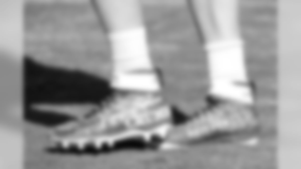 Philadelphia Eagles quarterback Carson Wentz wears personalized cleats as he warms up before an NFL football game against the Tennessee Titans Sunday, Sept. 30, 2018, in Nashville, Tenn. (AP Photo/Mark Zaleski)