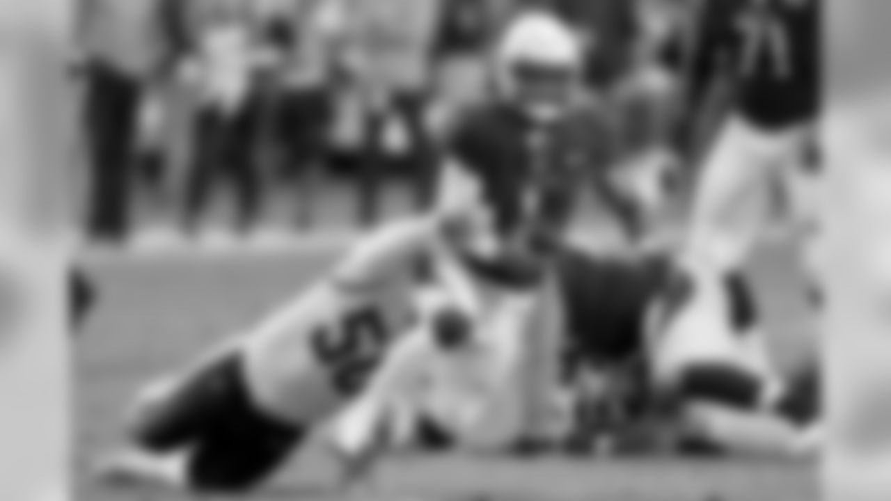 Cardinals quarterback Kyler Murray is tackled by Rams linebacker Samson Ebukam.