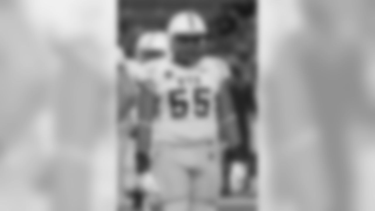 Wyoming defensive end Eddie Yarbrough (55) looks over to the sidelines in the third quarter of an NCAA college football game, Saturday, Oct. 11, 2014, in Honolulu. (AP Photo/Eugene Tanner)