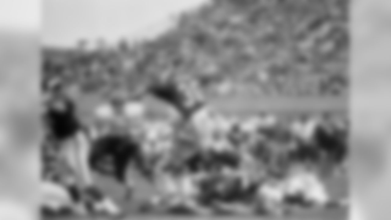 Minnesota Vikings ball carrier Bill Brown leaps over linemates for 2-yard gain against the Kansas City Chiefs in Minneapolis, on Sunday, Sept. 20, 1970 during National Football Conference game in Twin Cities Chief?s Willie Lanier (63) waits for Brown while Vikings Milt Sunde (64) falls on Chiefs player. (AP Photo/RW)