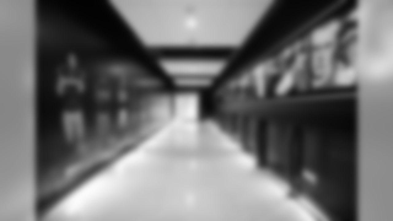 Fans then walk down a 90-foot-long corridor lined with eight 84-inch TVs showing players making their way toward the field.