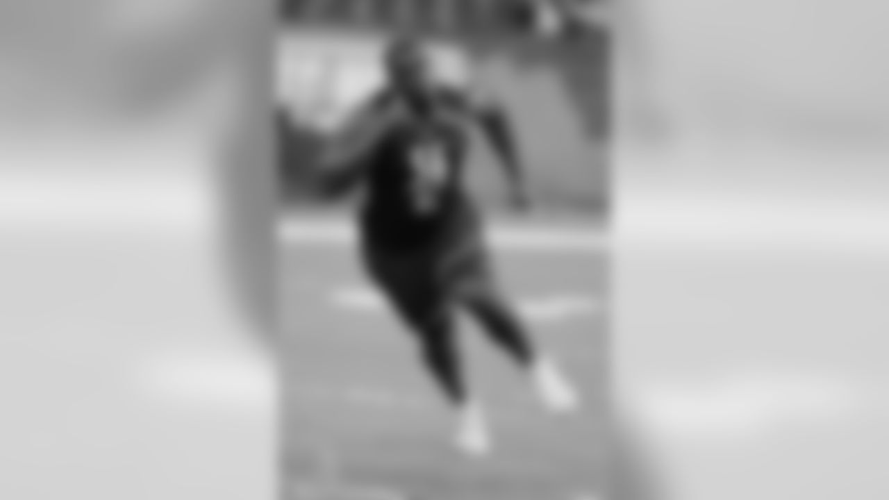 Elon offensive lineman olisaemeka Udoh runs a drill during the NFL football scouting combine, Friday, March 1, 2019, in Indianapolis. (AP Photo/Darron Cummings)