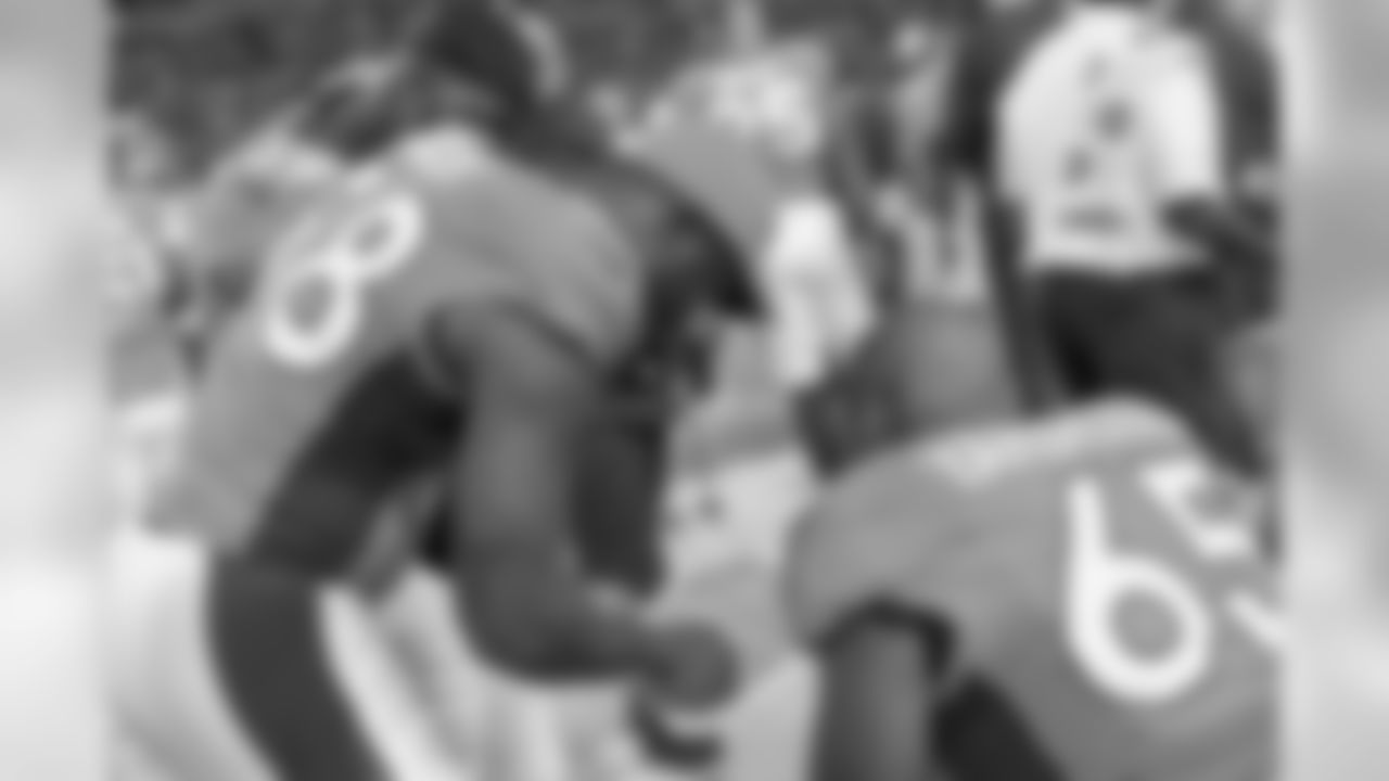 Denver Broncos linebacker Von Miller (58) goes over game photos with Eddie Yarbrough (65) during action against the San Francisco 49ers in the NFL game at Sports Authority Field in Denver, Colo. August 20, 2016. (Eric Bakke via AP)