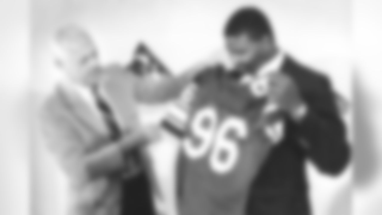 FILE - In this May 1, 1985, file photo, Minnesota Vikings head coach Bud Grant holds up the new jersey to their first-round draft pick Chris Doleman at a press conference to introduce the linebacker from Pittsburgh in Eden Prairie, Minn. Hall of Fame defensive end Doleman, who became one of the NFL's most feared pass rushers during 15 seasons in the league, has died. He was 58. The Vikings and Pro Football Hall of Fame president and CEO David Baker offered their condolences in separate statements late Tuesday night, Jan. 29, 2020. (AP Photo/Larry Salzman, File)