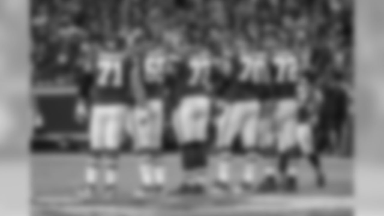 The Kansas City Chiefs offensive line including Mitchell Schwartz, Jordan Devey, Zach Fulton, Bryan Witzmann and Eric Fisher wait to huddle in action against the Washington Redskins during a NFL football game on Monday, Oct. 2, 2017, in Kansas City, Mo. The Chiefs defeated the Redskins, 29-20. (G. Newman Lowrance via AP)