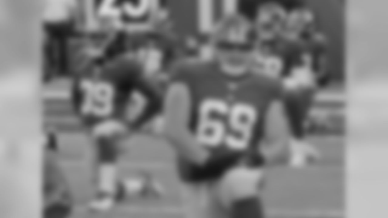 New York Giants center Brett Jones (69) stretches with teammates before playing against the Miami Dolphins in an NFL football game, Friday, Aug. 12, 2016, in East Rutherford, N.J. (AP Photo/Ray Stubblebine)