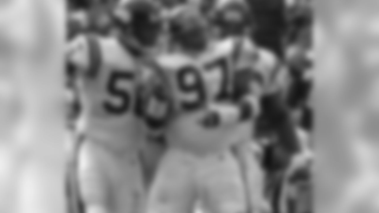 San Francisco 49ers vs. Minnesota Vikings at Candlestick Park Sunday, October 3, 1993. 49ers beat Vikings 38-19. Minnesota Vikings defensive end Chris Doleman (56) and defensive tackle Henry Thomas (97) celebrate sacking Steve Young. (AP Photo/Al Golub)
