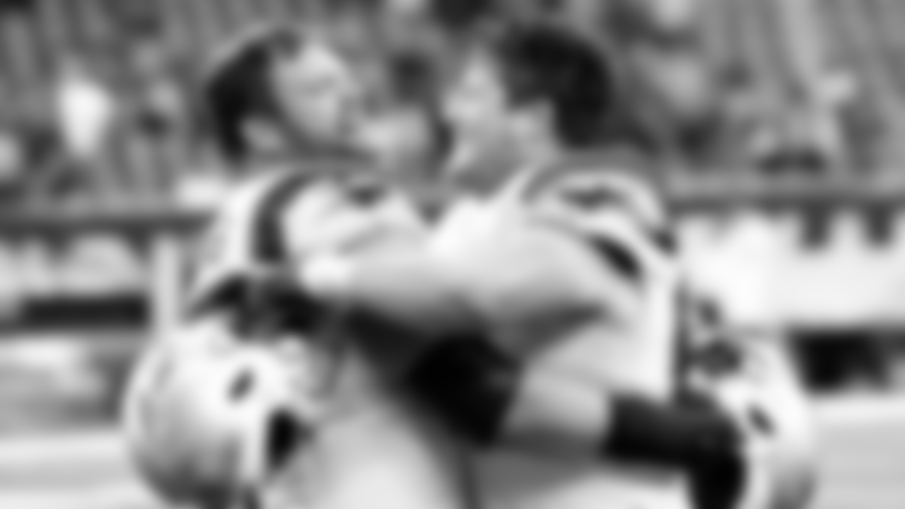 New England Patriots' Ted Karras, left, and James Ferentz celebrate after an NFL football game against the Houston Texans Sunday, Oct. 10, 2021, in Houston. (AP Photo/Justin Rex)